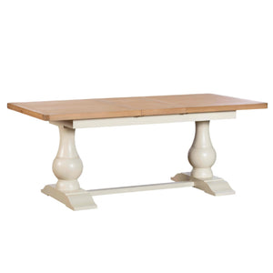 Dining table with wooden top and white base on a white background