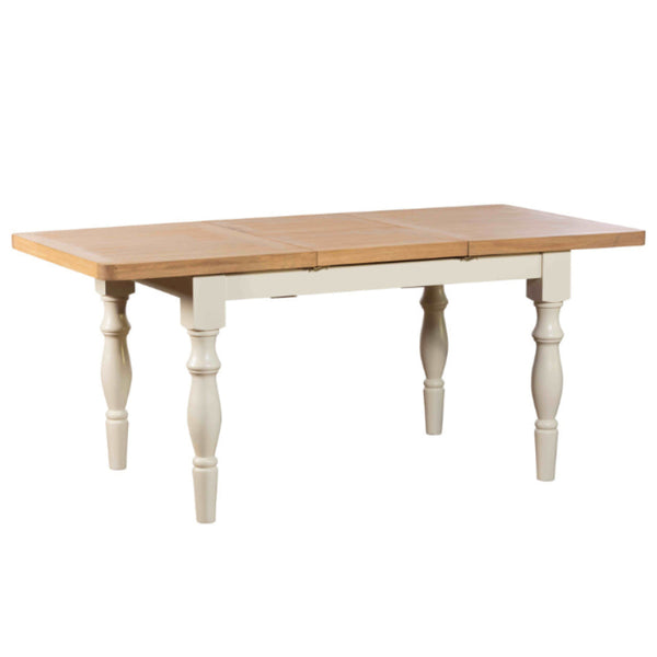Wooden dining table with white base on a white background