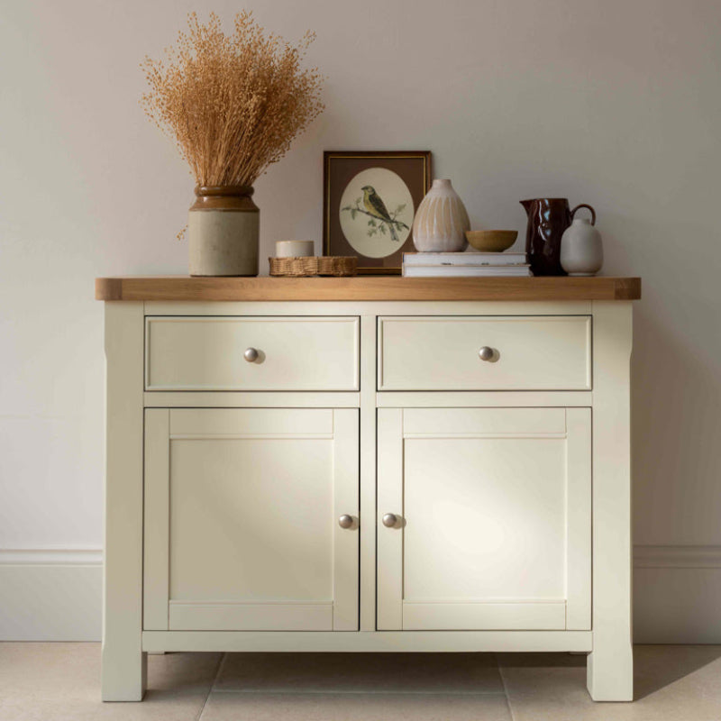 White sideboard with wooden top on a white background