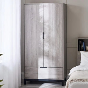 Wooden wardrobe with a bed in a bedroom setting