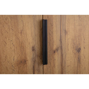Black handle on a wooden cabinet door