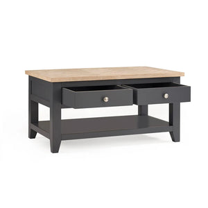 Coffee table with wooden top and dark gray base on a white background
