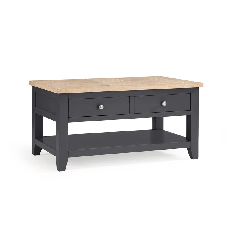 Wooden coffee table with dark gray base on a white background