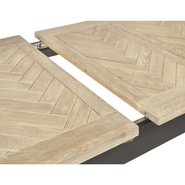Wooden table with herringbone pattern on a white background