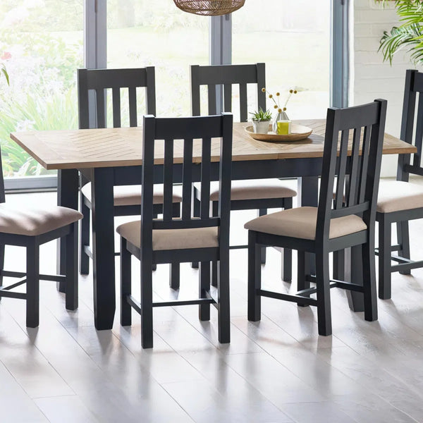 Dining table set with chairs in a bright room
