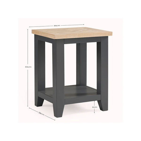 Small table with a light wooden top and dark gray base, showing dimensions on a white background.