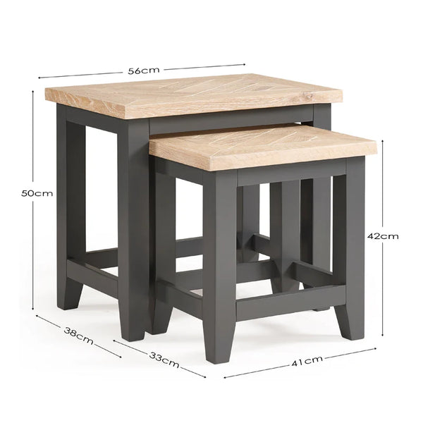 Two wooden nesting tables with dimensions labeled on a white background