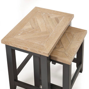 Wooden nesting tables with geometric pattern on a white background