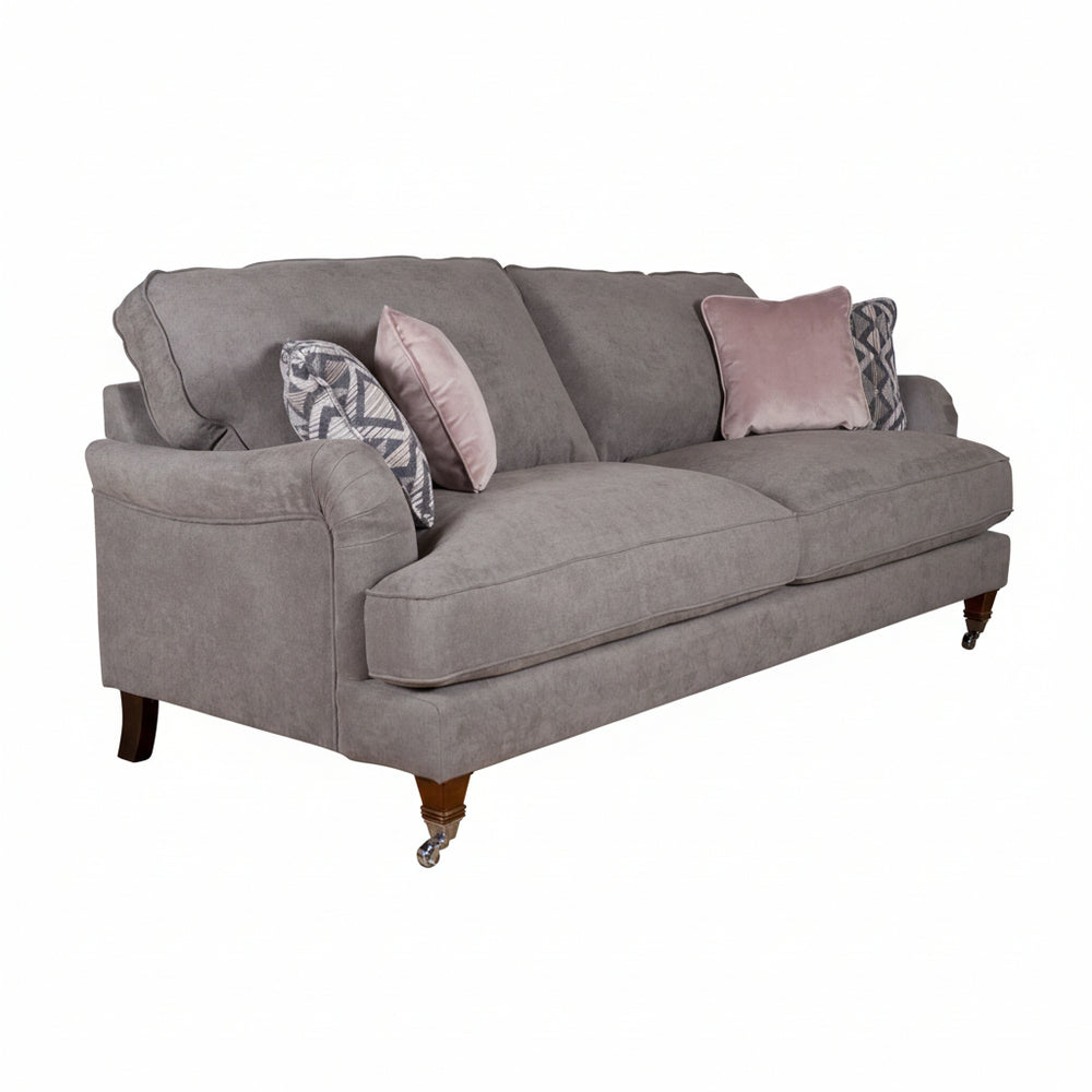 Gray sofa with decorative pillows on a white background