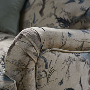 Close-up of a floral-patterned sofa armrest
