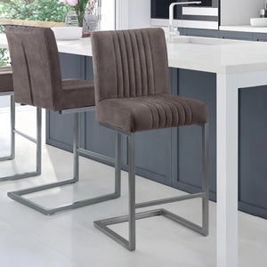 Brown bar stools with metal legs in a kitchen setting