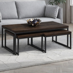 Wooden coffee table with a decorative bowl on top, placed in front of a gray sofa.