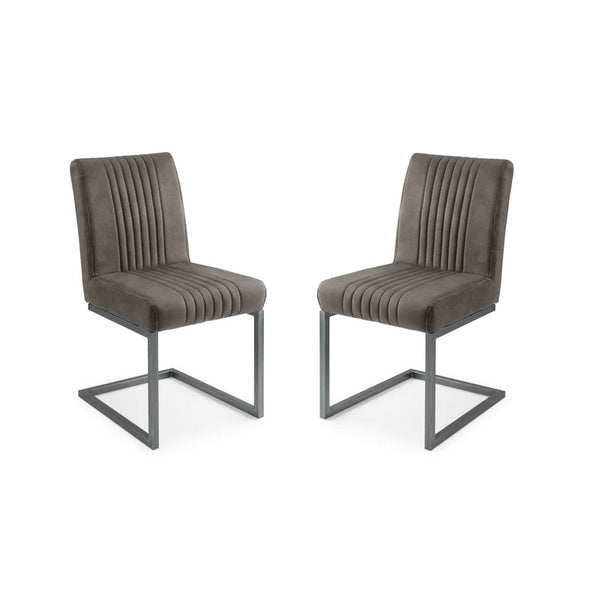 Two grey upholstered chairs with metal legs on a white background