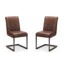 Two brown leather chairs with metal frames on a white background