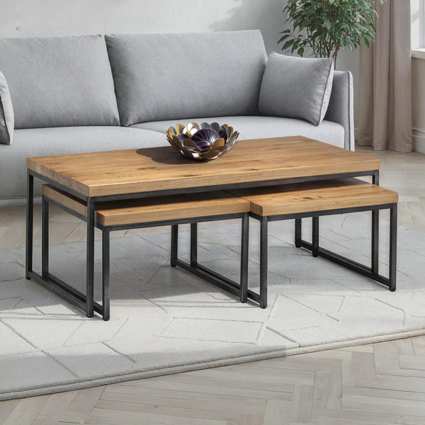 Wooden coffee table with metal legs in a living room setting