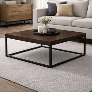 Wooden coffee table with decorative items in a living room setting
