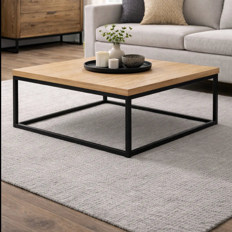 Square coffee table with wooden top and black metal frame on a white background