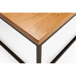 Wooden table corner with metal legs on a white background