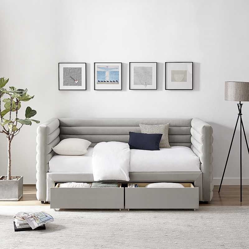Gray upholstered bed with storage drawers on a white background