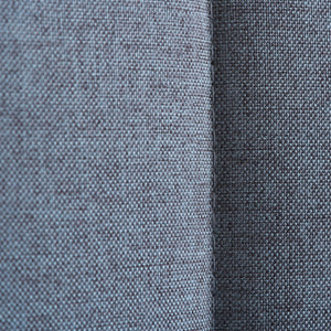 Close-up of two different textures of gray fabric