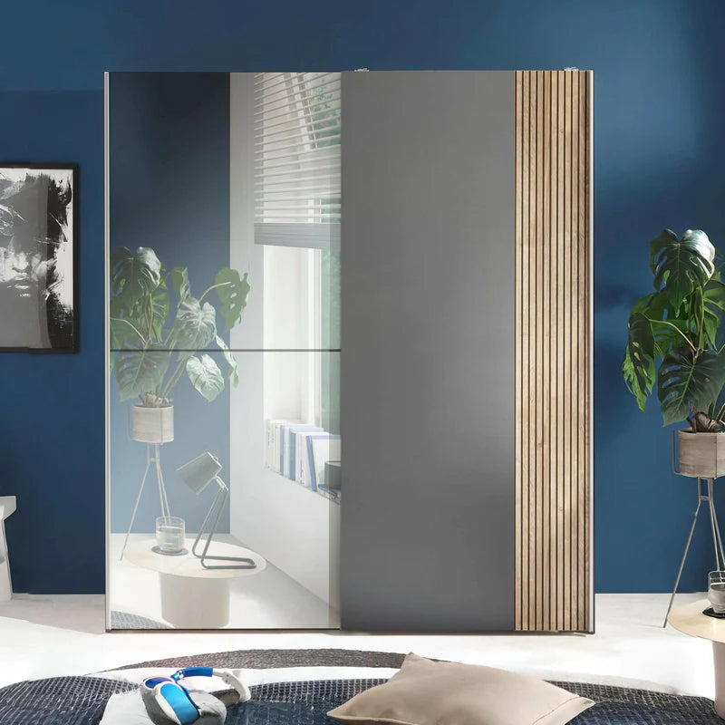 Modern wardrobe with mirror doors on a white background
