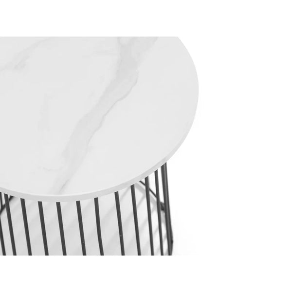 Round white table with black metal base on a white background