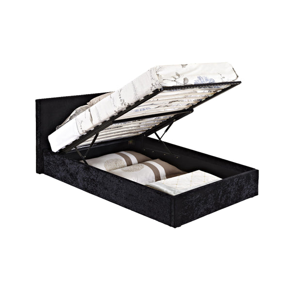 Black upholstered bed with open storage compartment on a white background