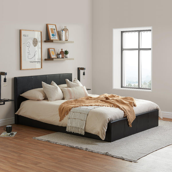 Modern bedroom with a black bed frame, white bedding, and decorative pillows.