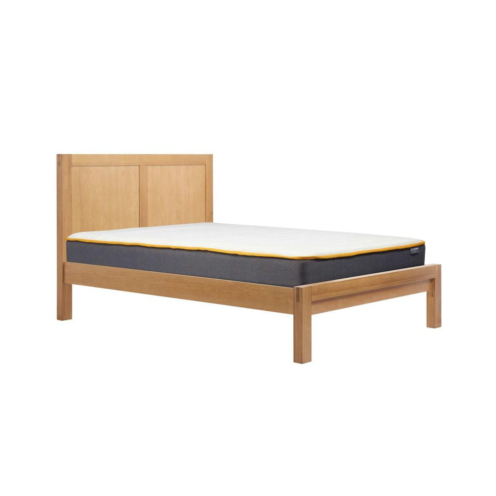 Wooden bed frame with mattress on a white background