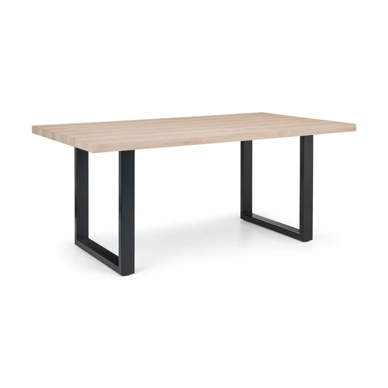 Table with wooden top and black metal legs on a white background