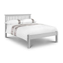 White wooden bed with gray bedding on a white background