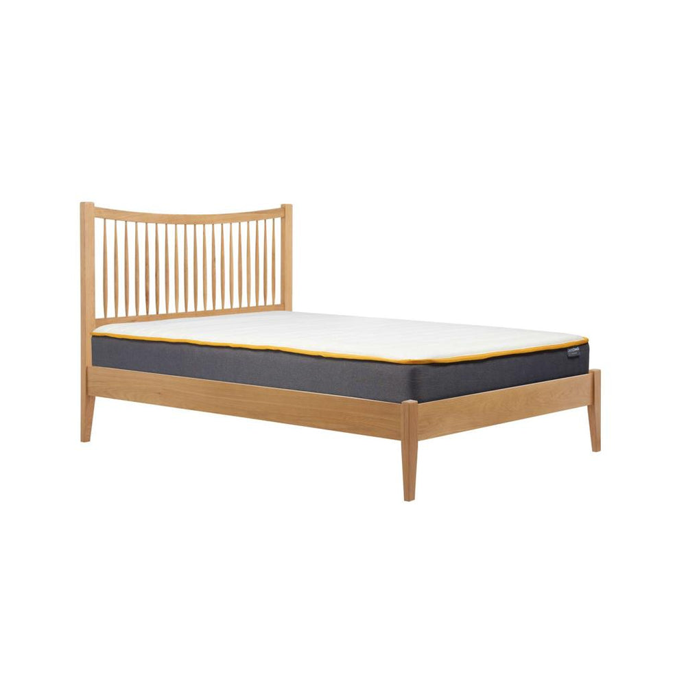 Wooden bed frame with mattress on a white background
