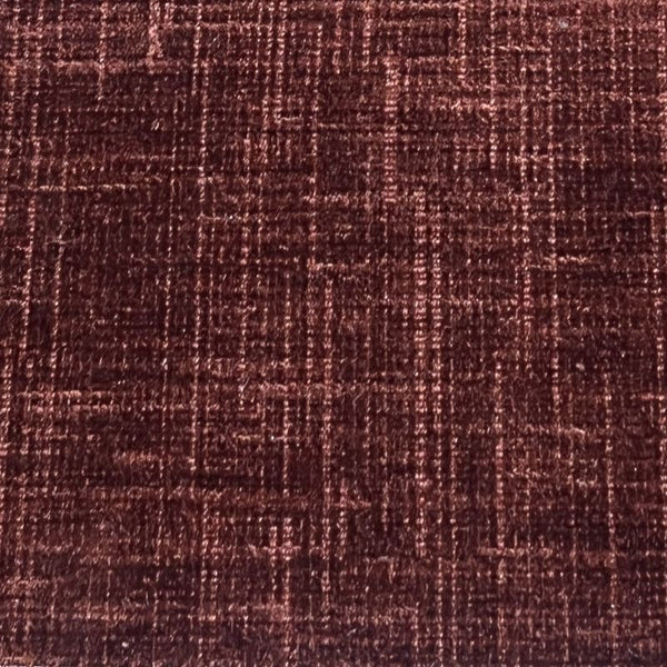 Close-up of a textured brown fabric with a subtle pattern
