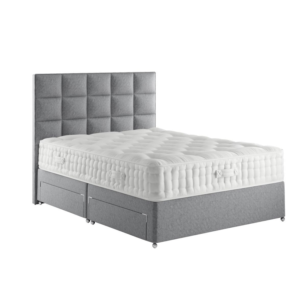 Gray upholstered bed with white mattress on a white background