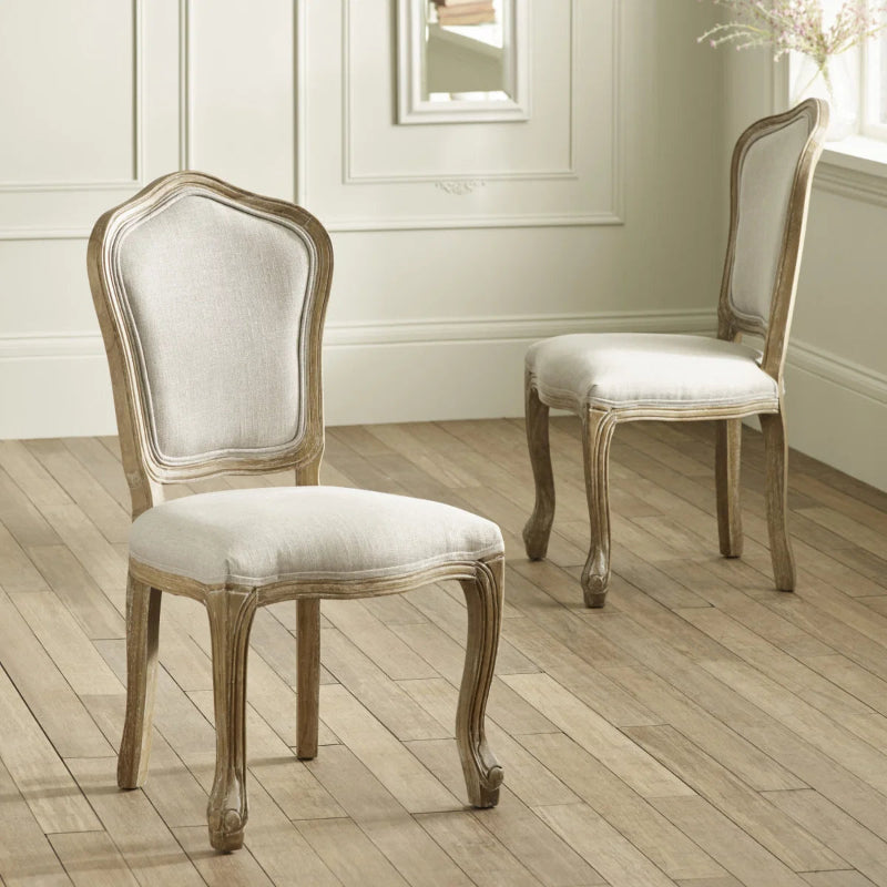 Pair of wooden chairs with upholstered seats and backrests on a white background