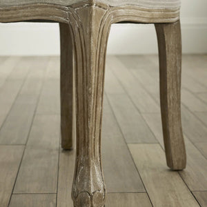 Close-up of a wooden chair leg on a wooden floor