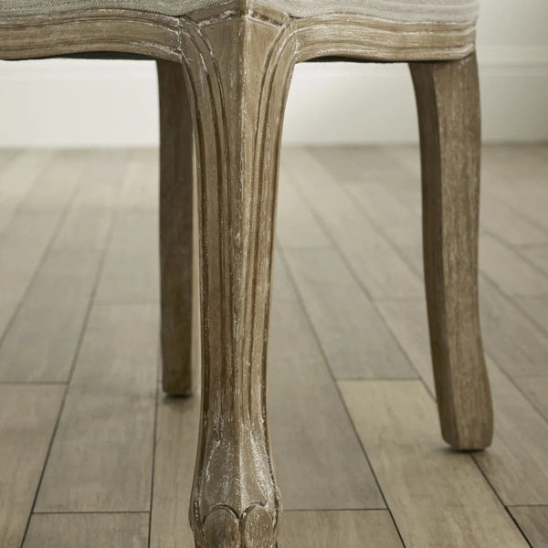 Close-up of a wooden chair leg on a wooden floor