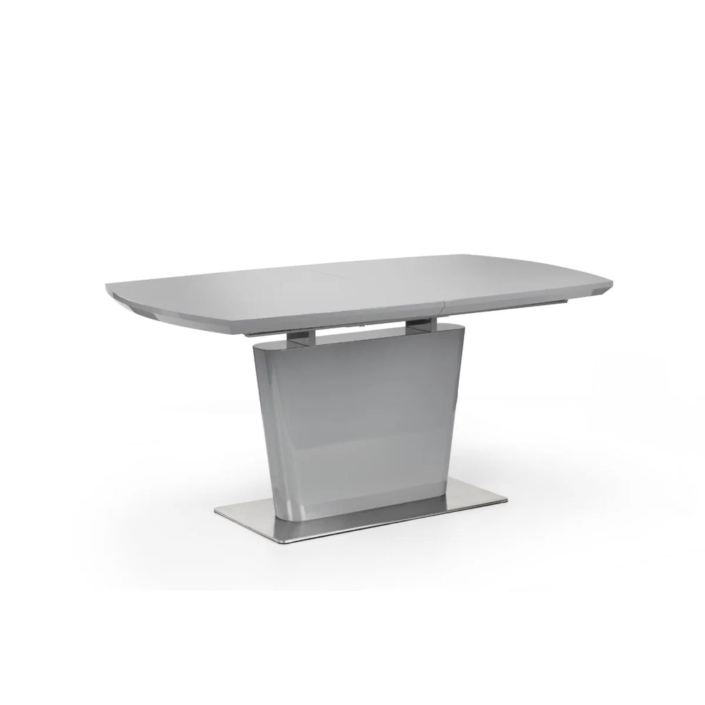 Modern dining table with a gray surface and metal base on a white background
