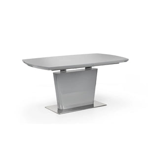 Modern dining table with a gray surface and metal base on a white background