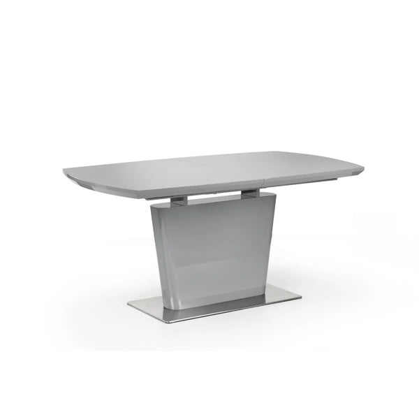 Modern dining table with a gray surface and metal base on a white background