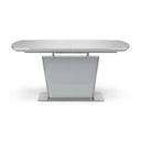 White extending dining table on a white background