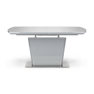White extending dining table on a white background
