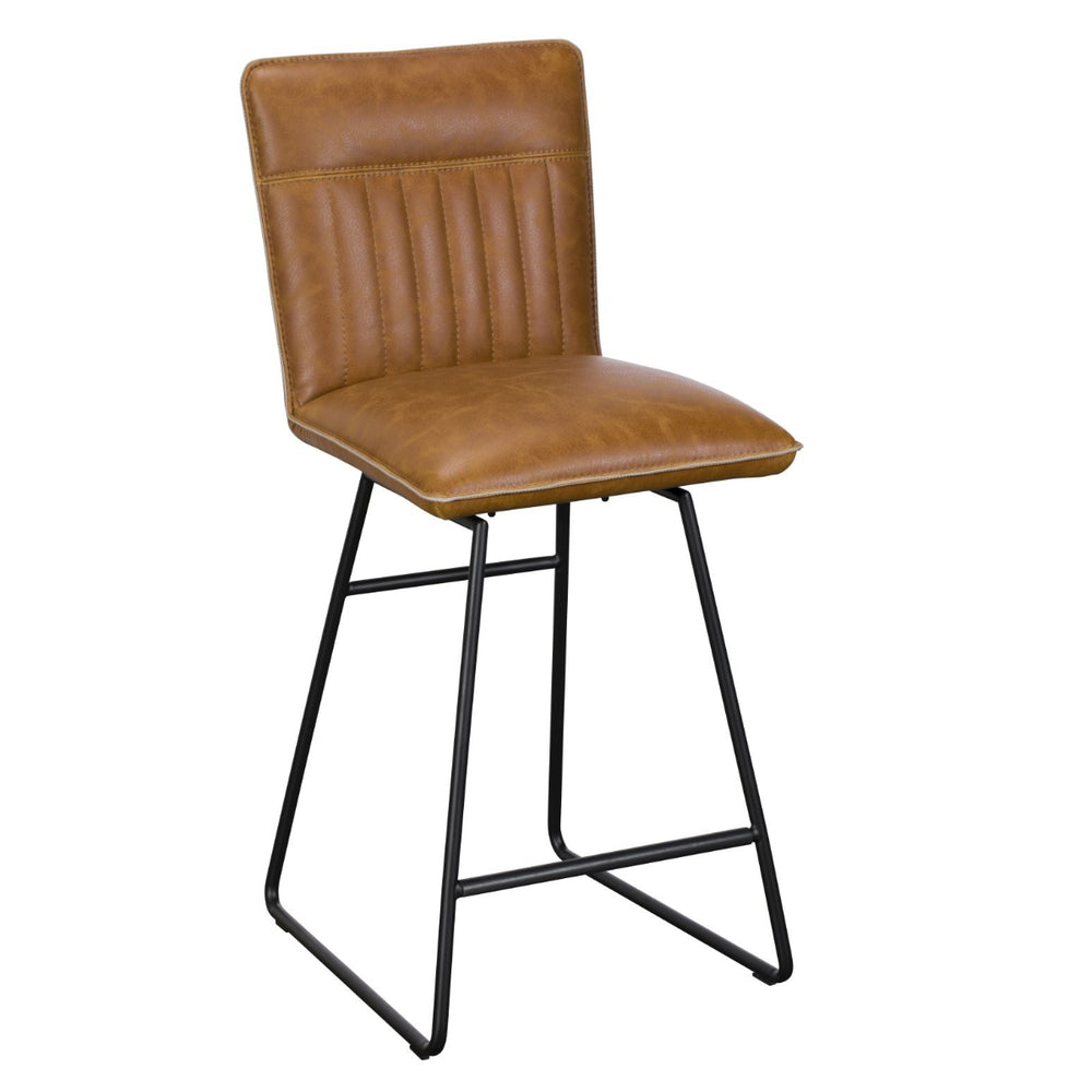 Brown leather bar stool with black metal legs on a white background