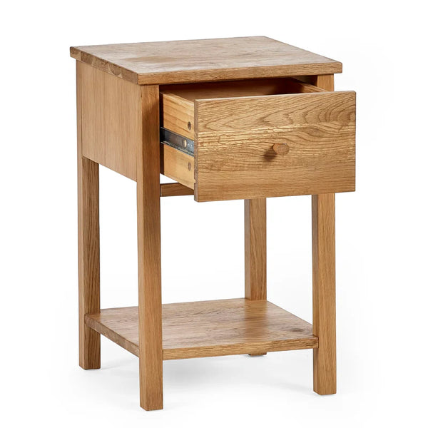 Wooden side table with a drawer on a white background