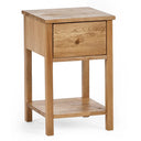 Wooden side table with a drawer on a white background