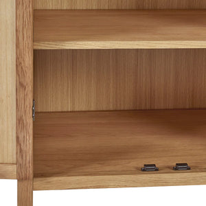 Close-up of a wooden cabinet with a focus on the door and handle.
