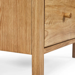 Wooden drawer with a visible grain pattern on a white background