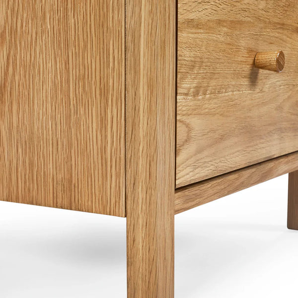 Wooden drawer with a visible grain pattern on a white background