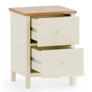 White nightstand with two drawers and a wooden top on a white background