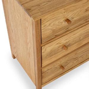 Wooden dresser with three drawers on a white background